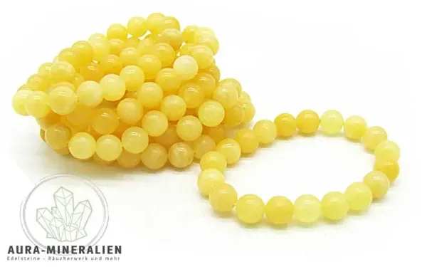 Orangencalcit Armband aus leuchtend orangen 8mm Kugeln auf Gummizug